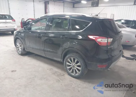 2017 Ford Escape Titanium z USA, uszkodzony, nr VIN 1FMCU9JD4HUE32081